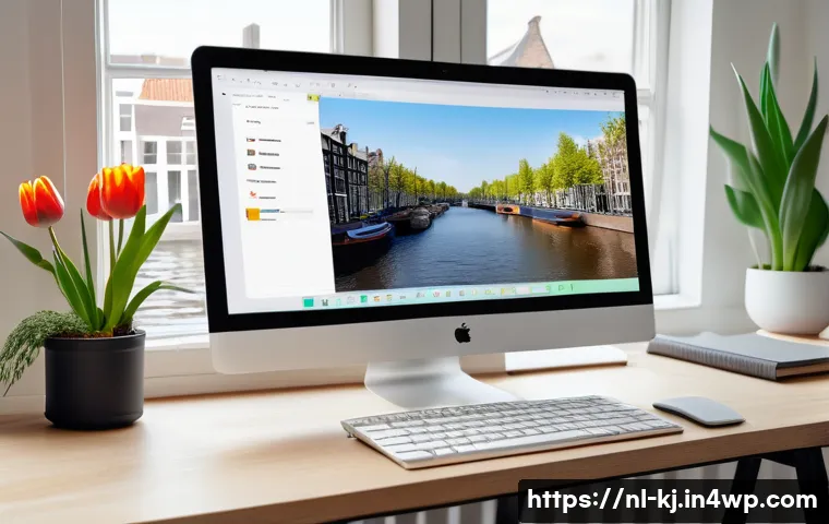 웹 기술을 통한 장애인 접근성 강화 방법 - A modern web developer’s workspace in Amsterdam, featuring a large monitor displaying a clear, consi...